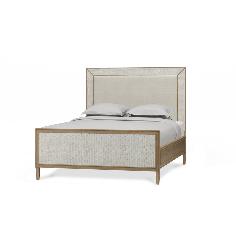 Belgravia Upholstered Queen Bed in Sandbar. Upholstered in Dinara Natural Fabric w/ White Rattan.